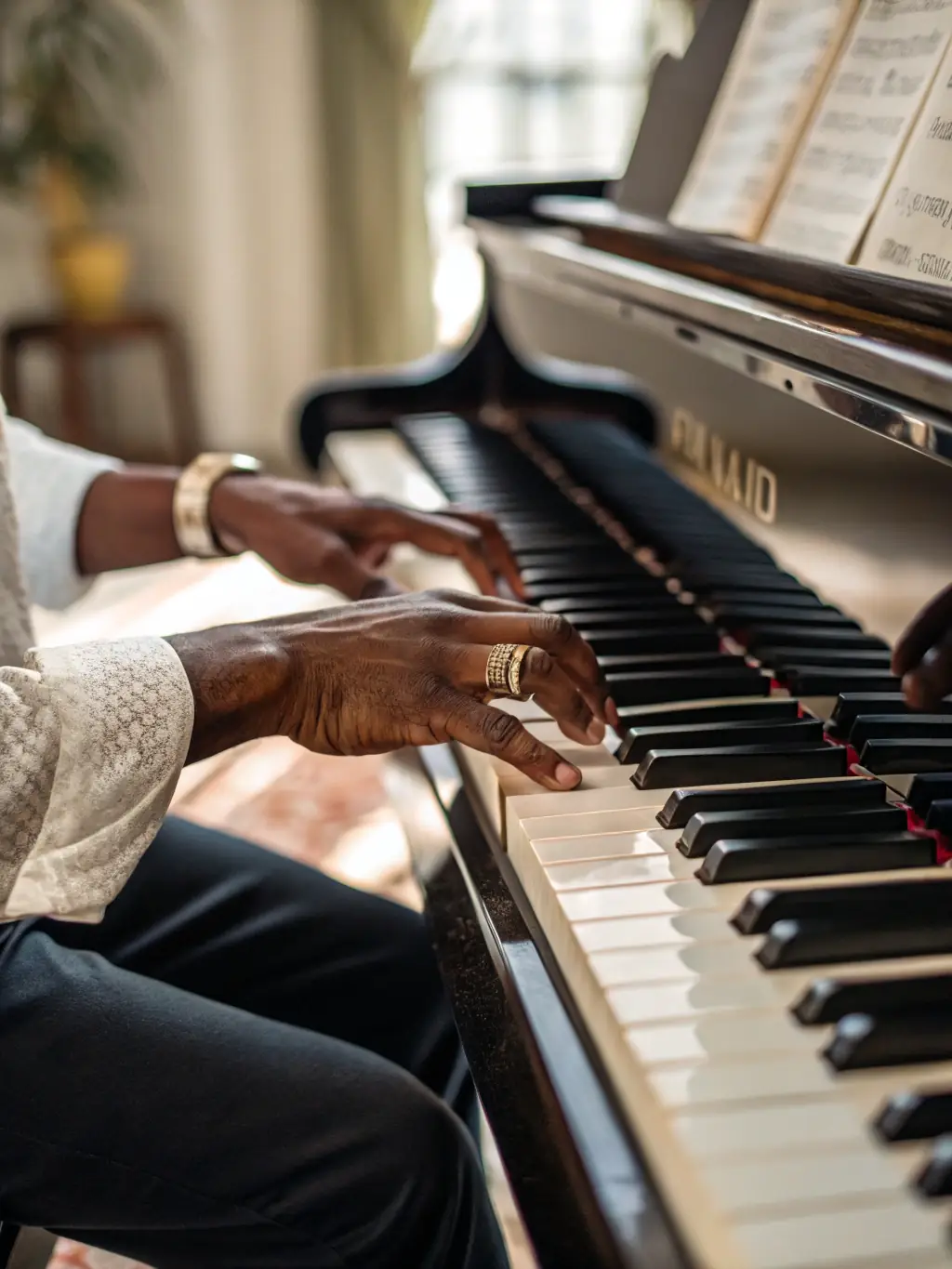 A close-up shot of a piano keyboard with hands playing, symbolizing the focused learning environment of MUSIC'ARTE's piano masterclass.